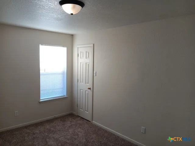a white toilet sitting next to a bath tub