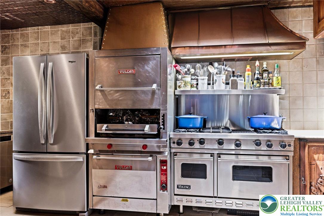 3791 Hunter Road Kintnersville, PA 18930 - Photo 16 of 55 a kitchen with stainless steel appliances a stove and a refrigerator