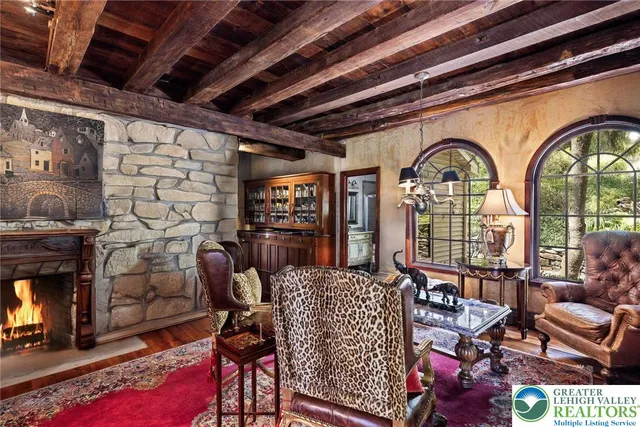 a patio with a table and chairs under an umbrella