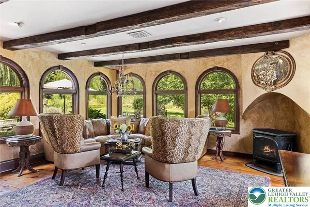 a bathroom with a sink a mirror a vanity and a shower