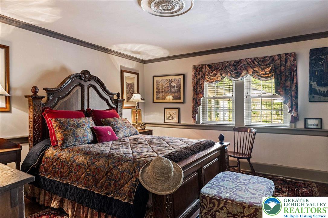 3791 Hunter Road Kintnersville, PA 18930 - Photo 25 of 55 a bedroom with a bed a dresser with chair and window