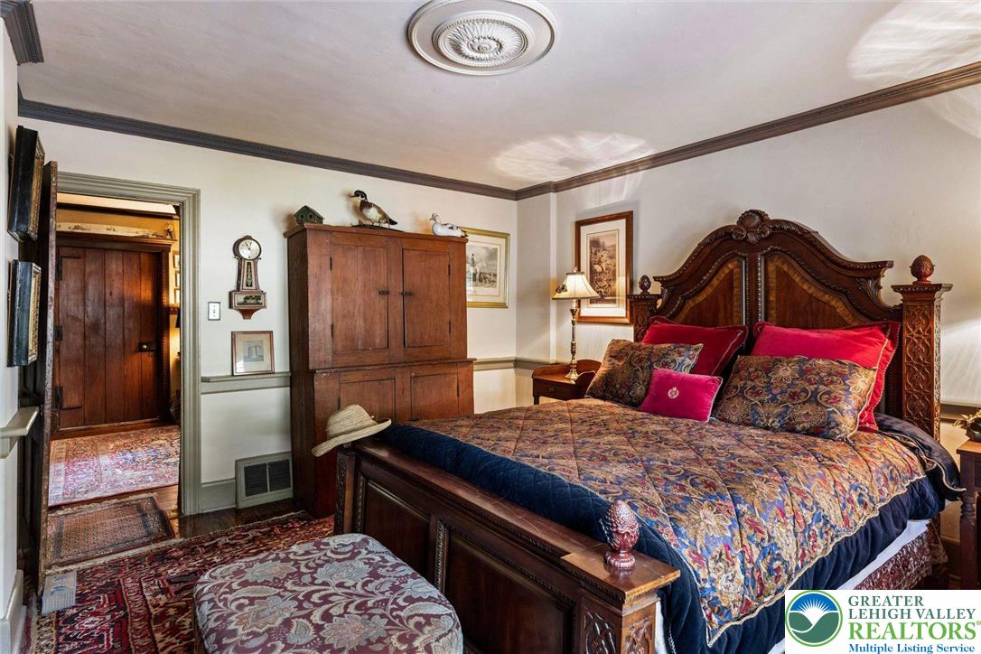 3791 Hunter Road Kintnersville, PA 18930 - Photo 26 of 55 a bedroom with a bed and a dresser