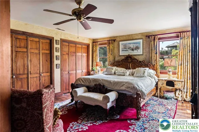 a bedroom with a bed and glass window