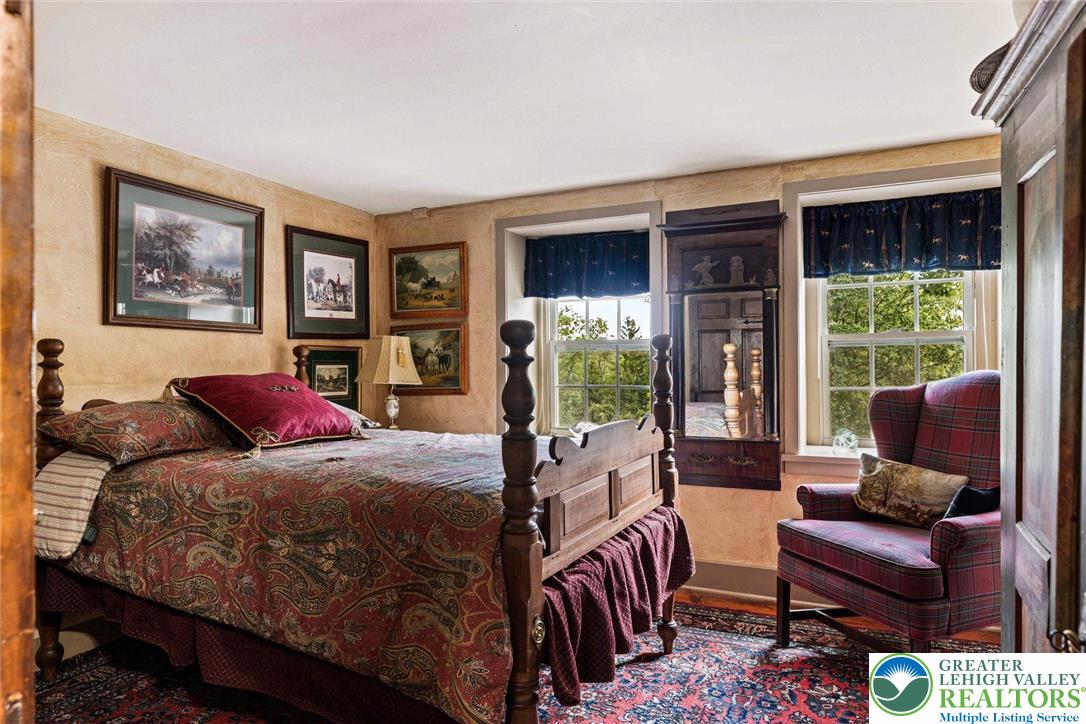 3791 Hunter Road Kintnersville, PA 18930 - Photo 33 of 55 a bedroom with a bed and glass window