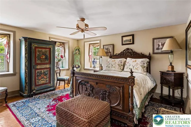 a living room with furniture a fireplace and a window