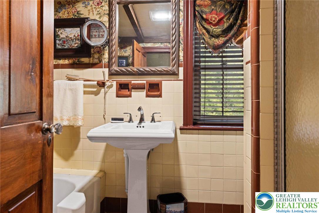 3791 Hunter Road Kintnersville, PA 18930 - Photo 35 of 55 a bathroom with a sink and a mirror