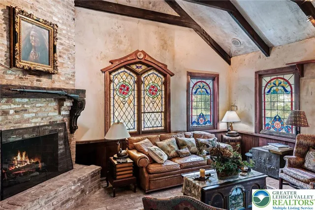 a dining room with wooden floor table and chairs