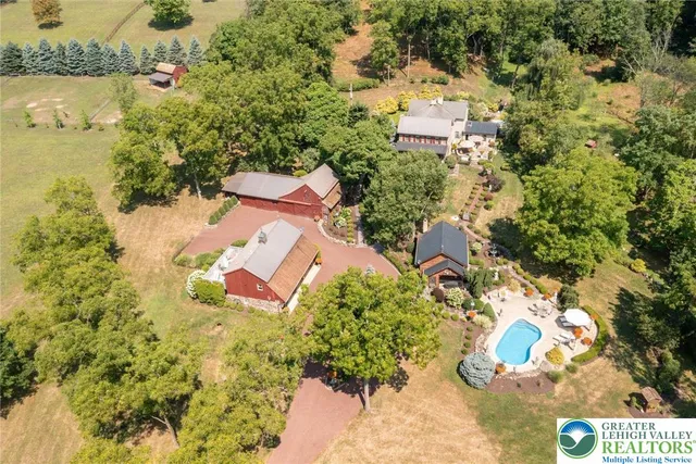 an aerial view of residential houses with outdoor space
