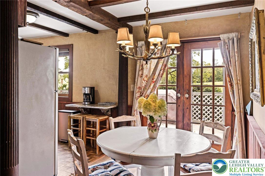 3791 Hunter Road Kintnersville, PA 18930 - Photo 47 of 55 a dining room with wooden floor table and chairs