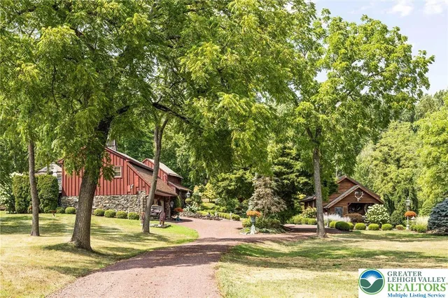 a view of a trees and front view of a house