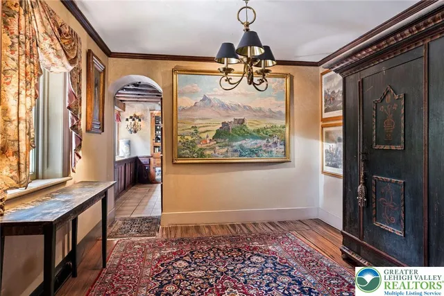 a view of an entryway with wooden floor and windows