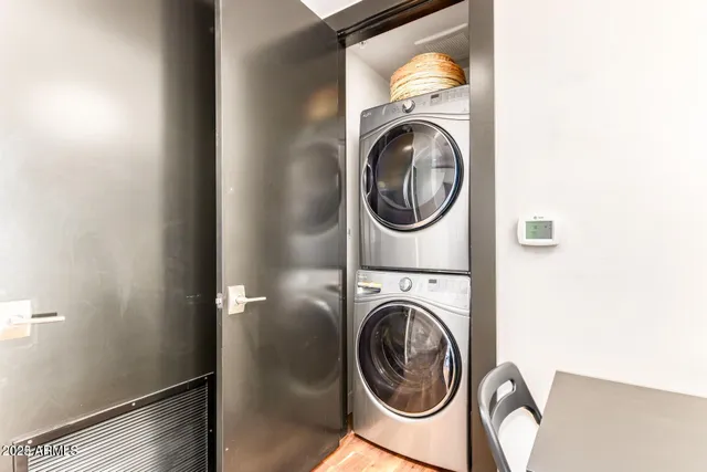 a view of a hallway with washer and dryer