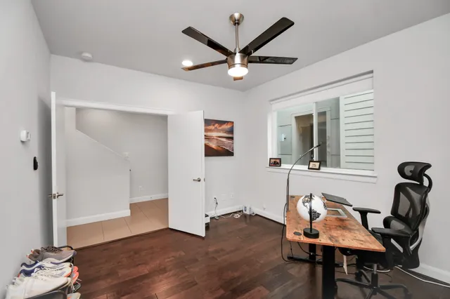 a view of a livingroom with furniture and wooden floor