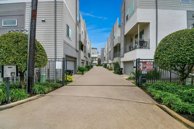 a view of a street with brick building in front of it