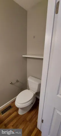 a bathroom with a toilet and a sink