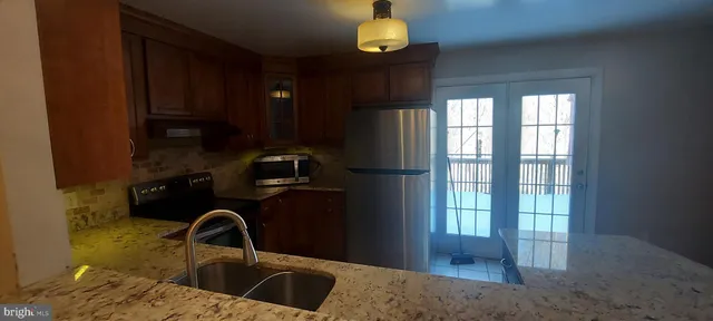 a bathroom with a sink and a window