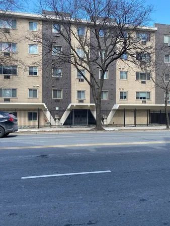 a view of a building with a large tree