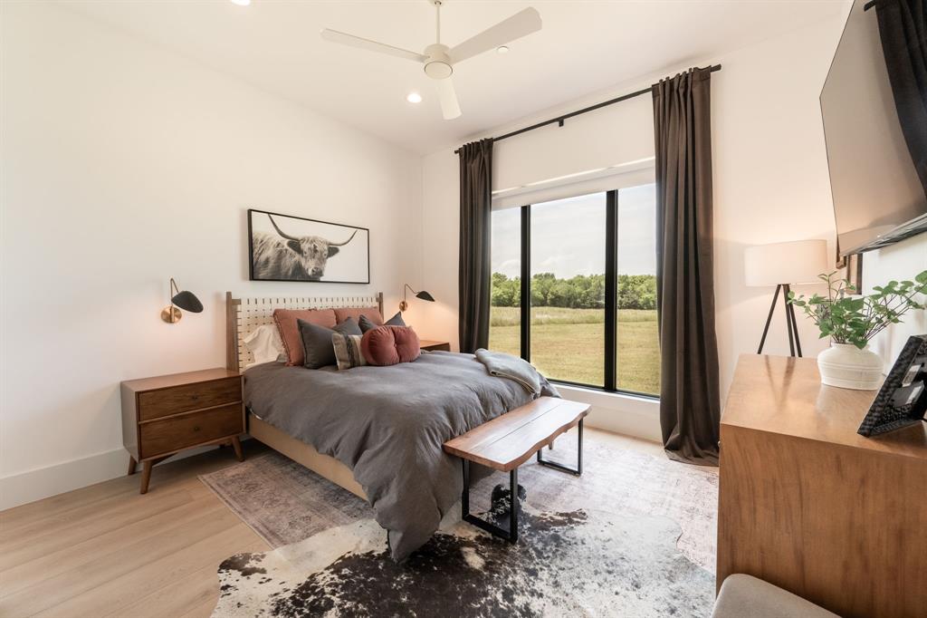 2396 County Road 2145 Cooper, TX 75432 - Photo 24 of 40 a bed room with a bed and a couch