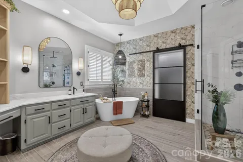a spacious bathroom with a granite countertop sink a toilet and shower