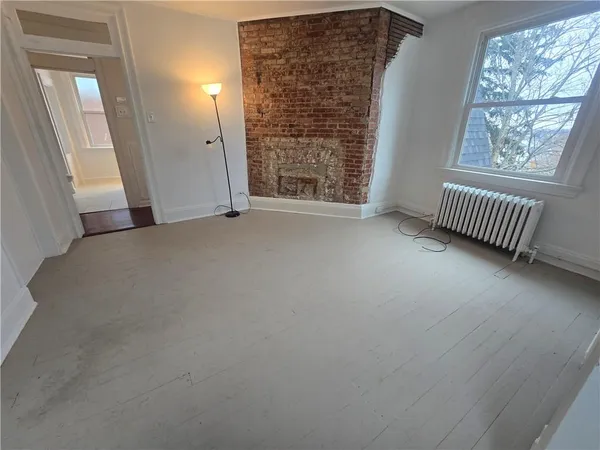 a view of an empty room and window