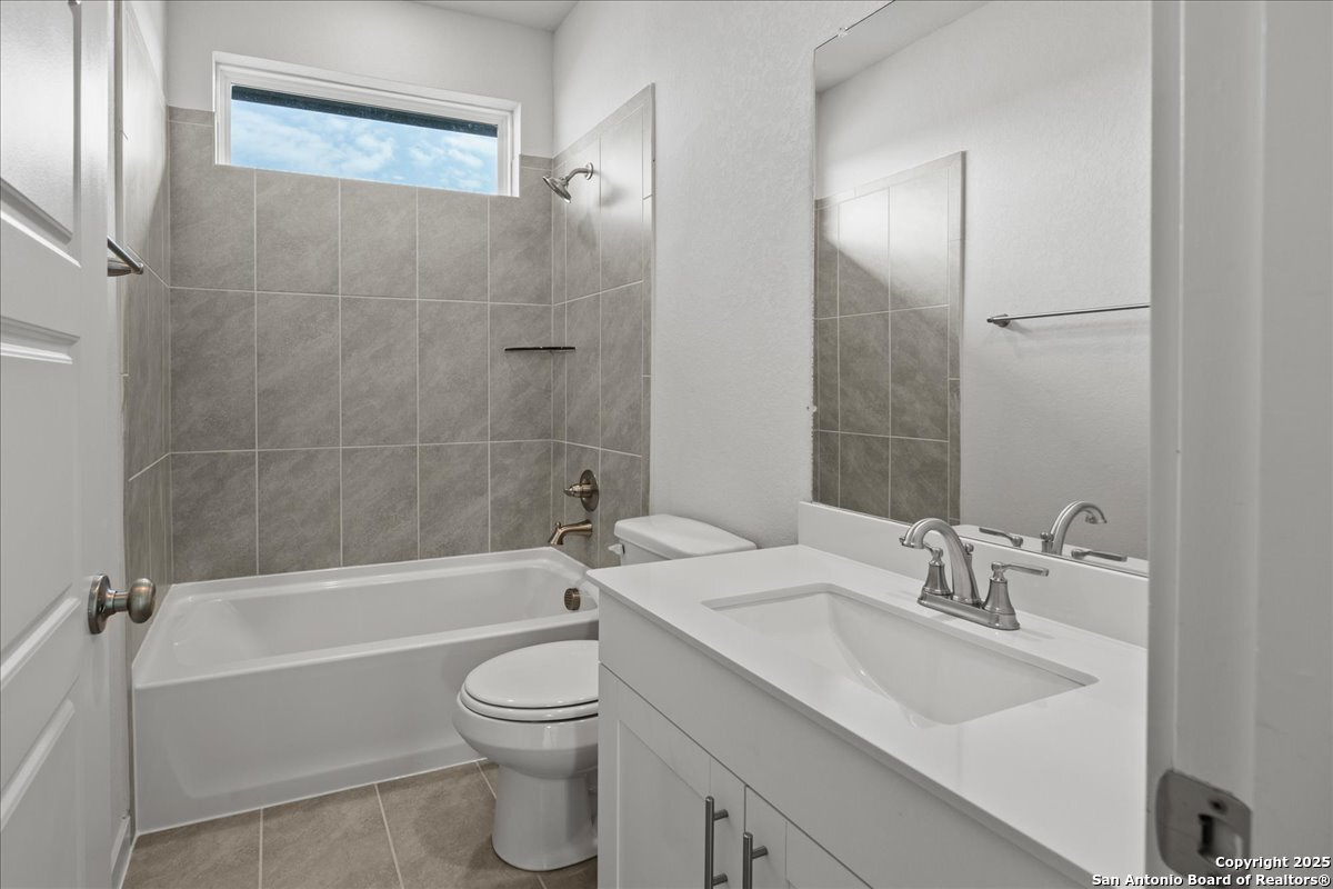 2130 Shepards Street Seguin, TX 78155 - Photo 14 of 21 a bathroom with a sink a toilet and a bathtub