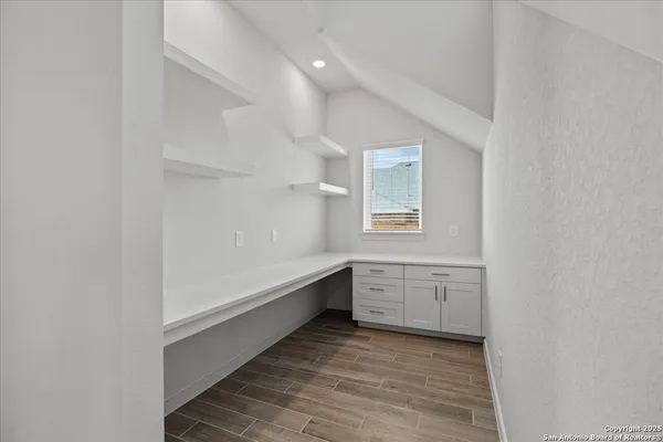 a room with window and cabinet