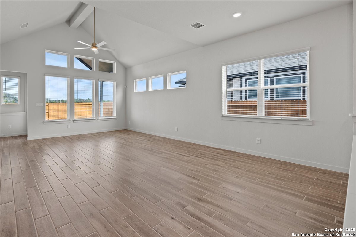 2130 Shepards Street Seguin, TX 78155 - Photo 7 of 21 a view of an empty room with wooden floor and a window