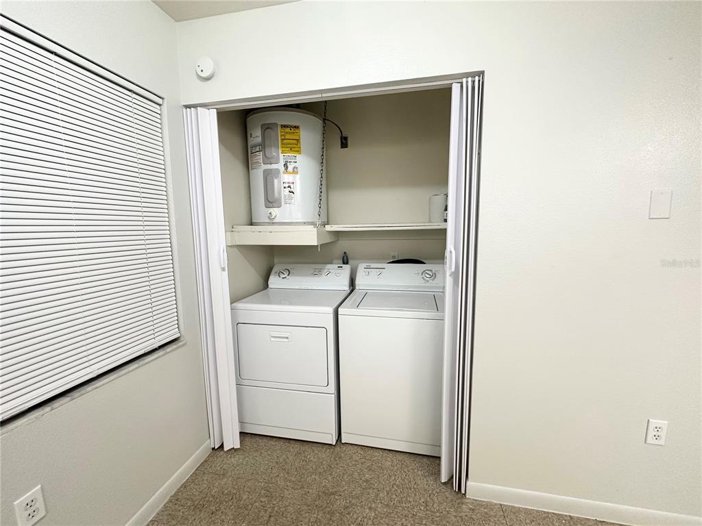 101 Lake Hunter Drive, Unit 15 Lakeland, FL 33803 - Photo 5 of 11 a storage room with a washer and dryer
