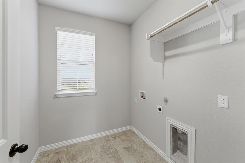 7437 Aniston Way Godley, TX 76044 - Photo 17 of 23 a view of an empty room with a window and closet