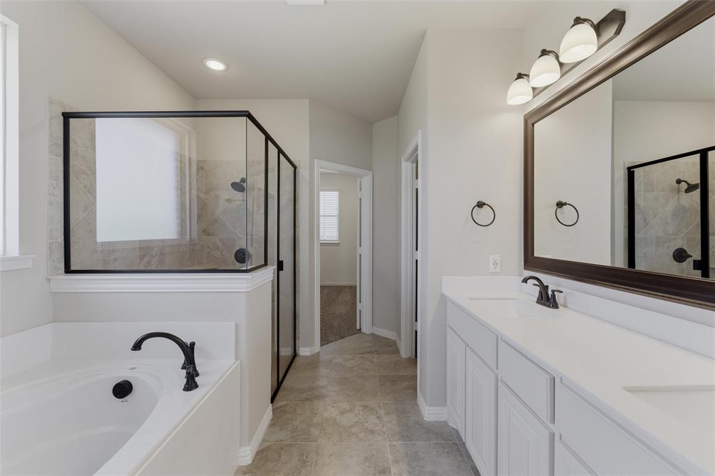 7437 Aniston Way Godley, TX 76044 - Photo 19 of 23 a bathroom with a sink and a mirror