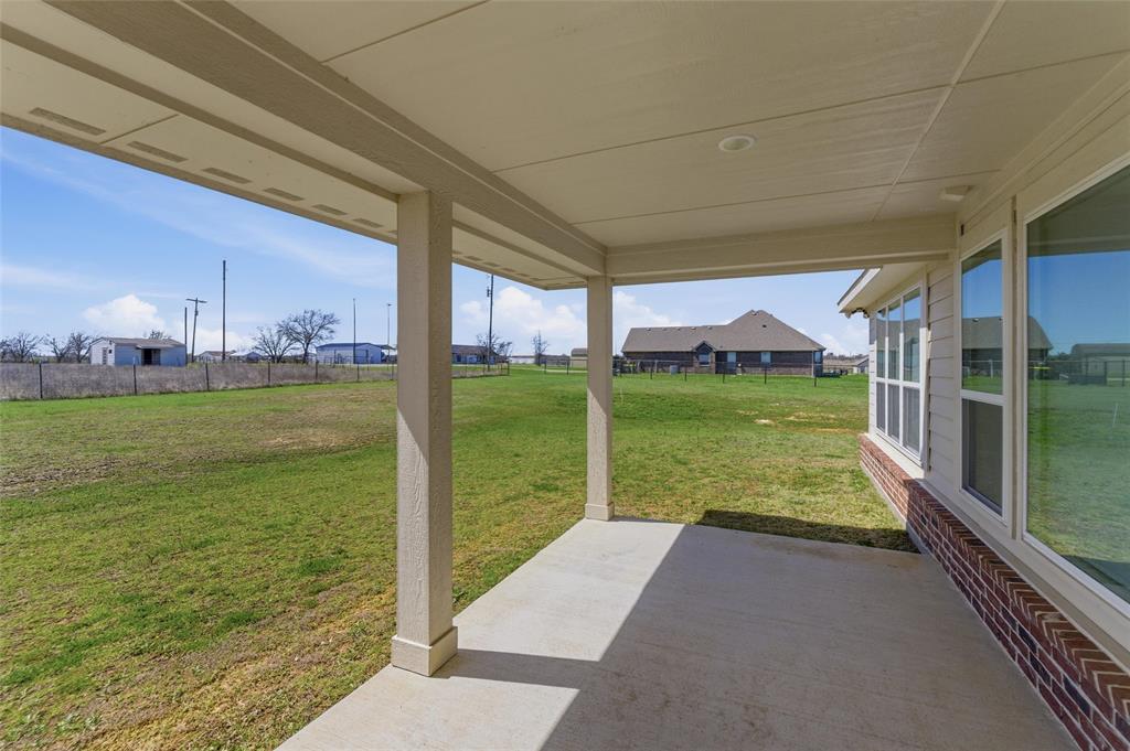 7437 Aniston Way Godley, TX 76044 - Photo 20 of 23 a view of a garden with an outdoor space