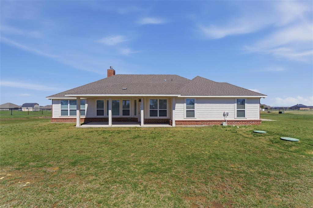 7437 Aniston Way Godley, TX 76044 - Photo 22 of 23 a front view of a house with a garden