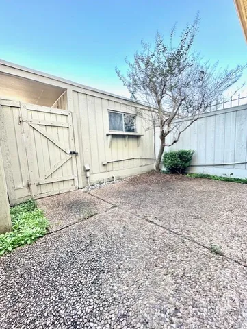 a view of a backyard of the house