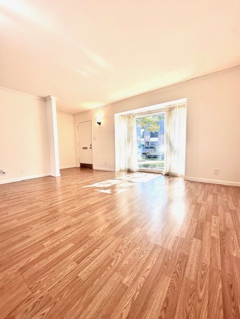 6332 Chevy Chase Drive, Unit 16 Houston, TX 77057 - Photo 9 of 32 a view of an empty room and wooden floor