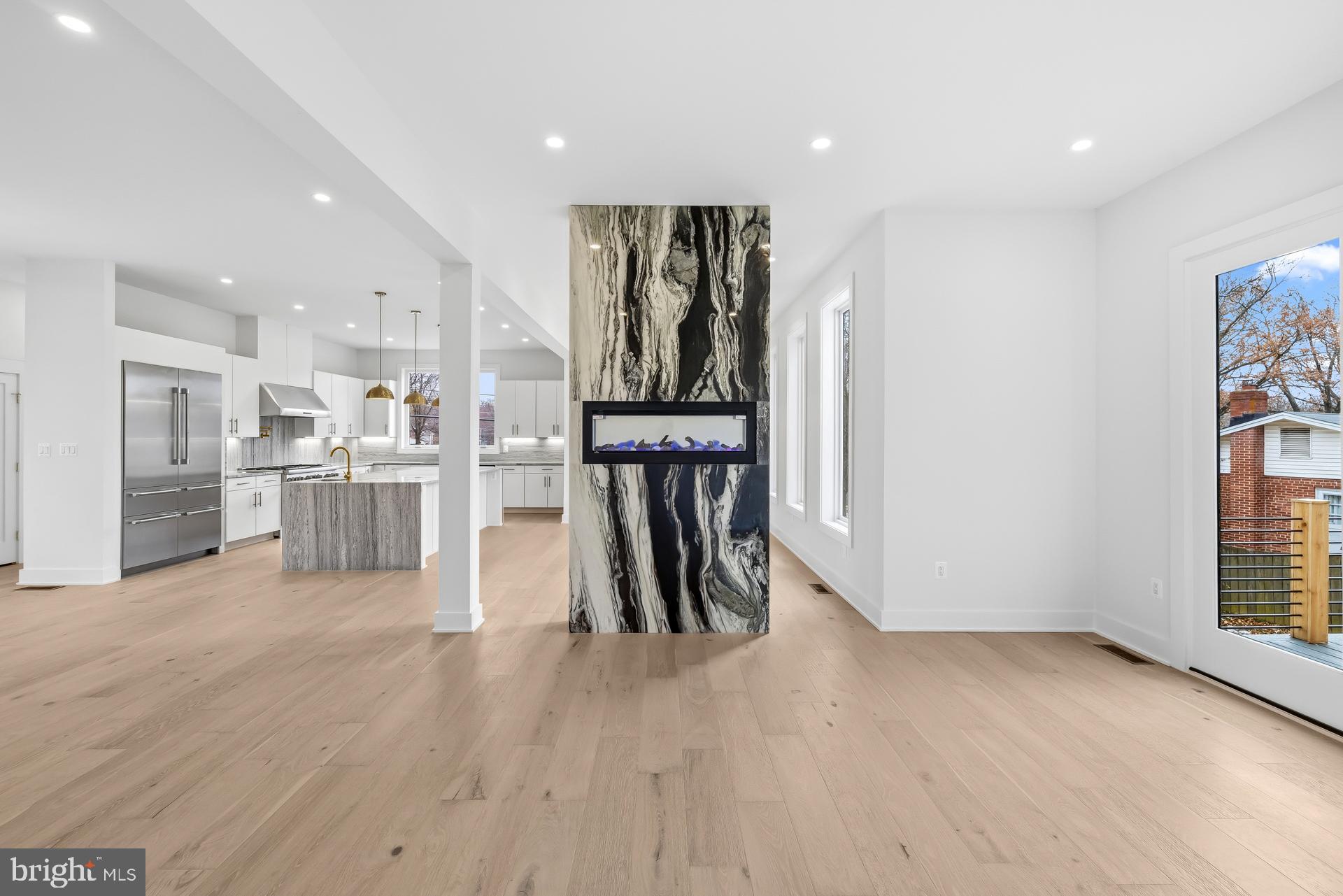 719 Meadow Lane Southwest Vienna, VA 22180 - Photo 17 of 118 a view of a kitchen with refrigerator and wooden floor