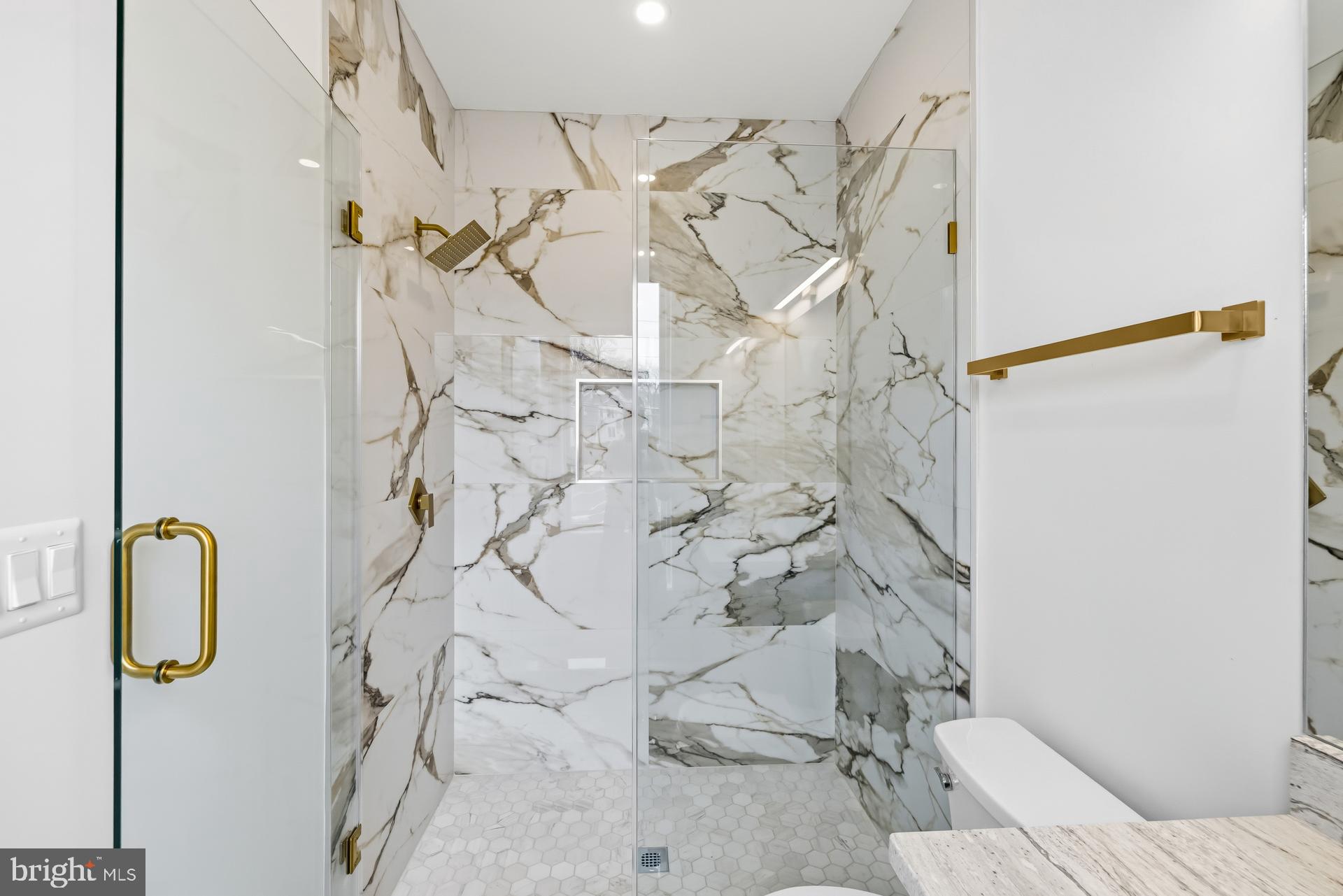 719 Meadow Lane Southwest Vienna, VA 22180 - Photo 64 of 118 a bathroom with shower and mirror