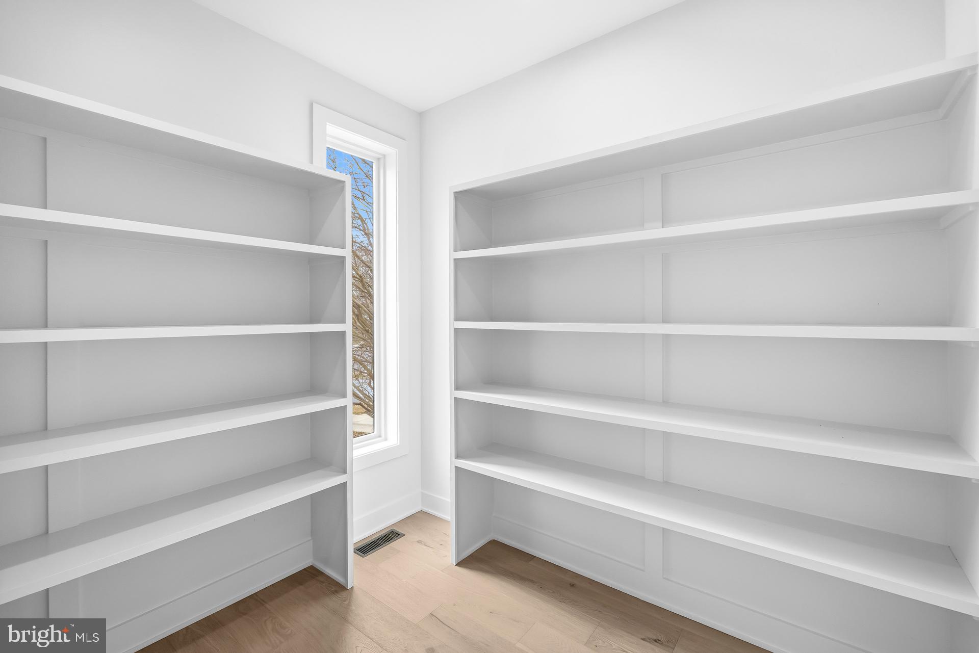 719 Meadow Lane Southwest Vienna, VA 22180 - Photo 69 of 118 a view of walk in closet with empty racks