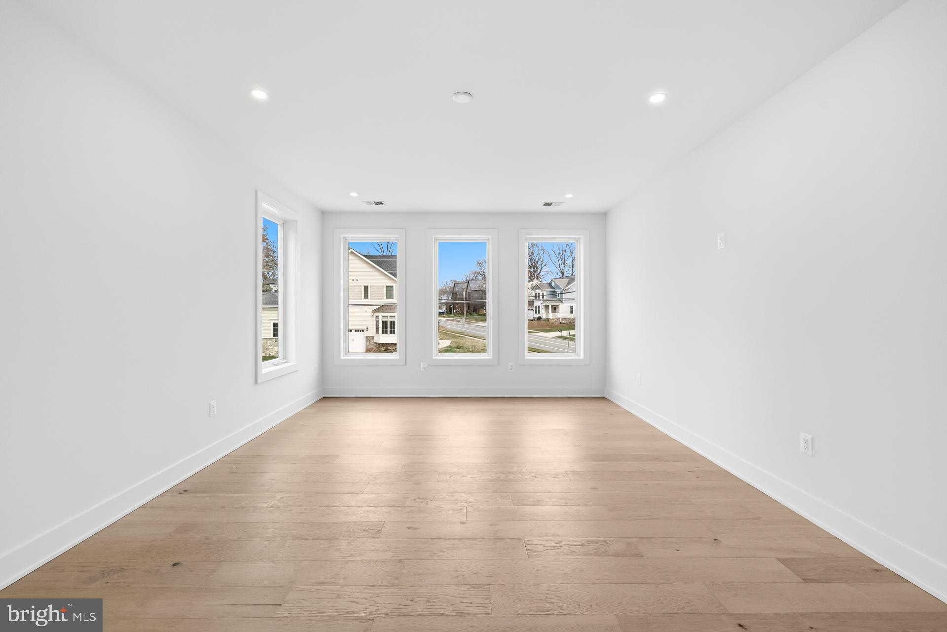 719 Meadow Lane Southwest Vienna, VA 22180 - Photo 76 of 118 wooden floor in an empty room with a window