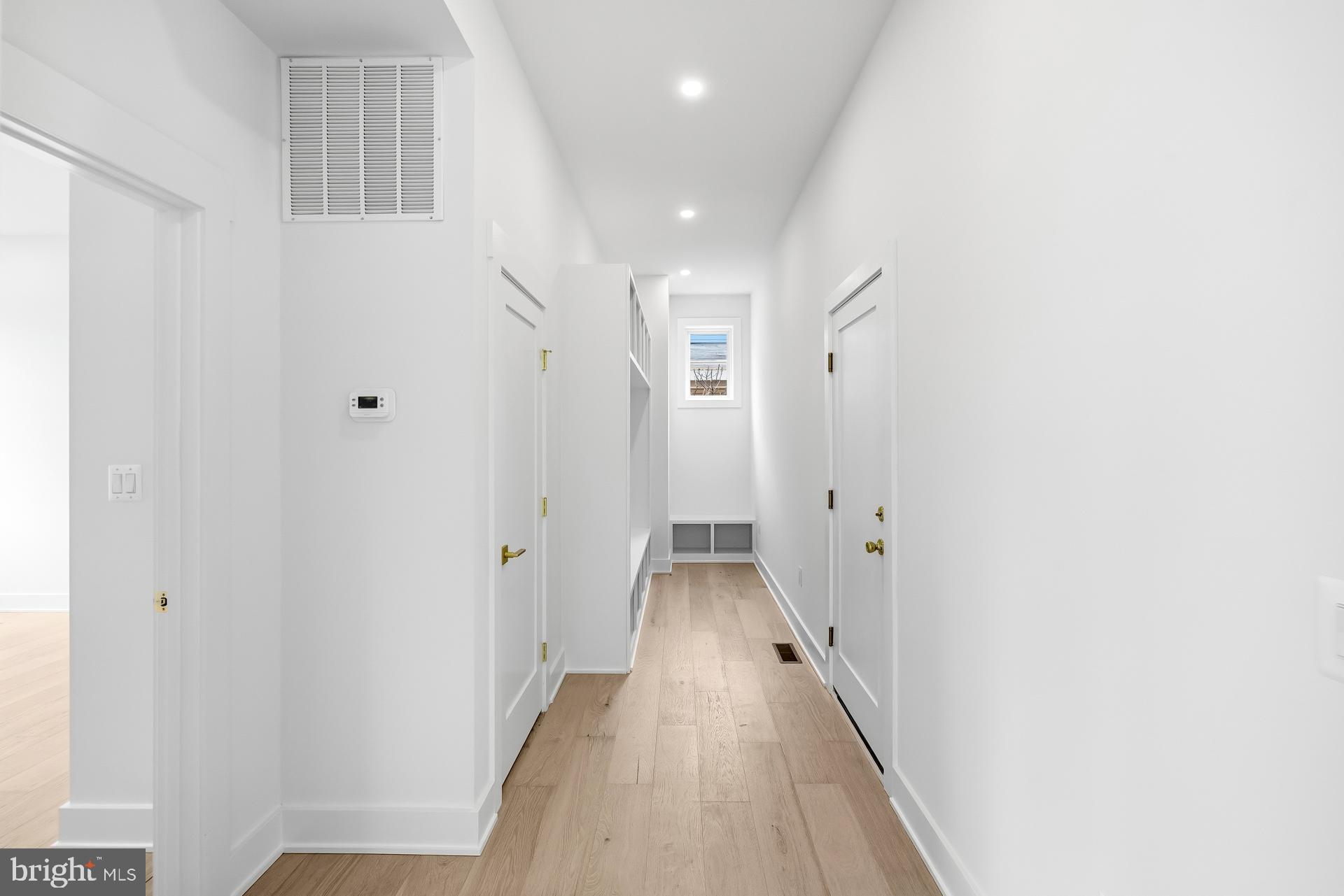 719 Meadow Lane Southwest Vienna, VA 22180 - Photo 78 of 118 a view of a hallway with wooden floor