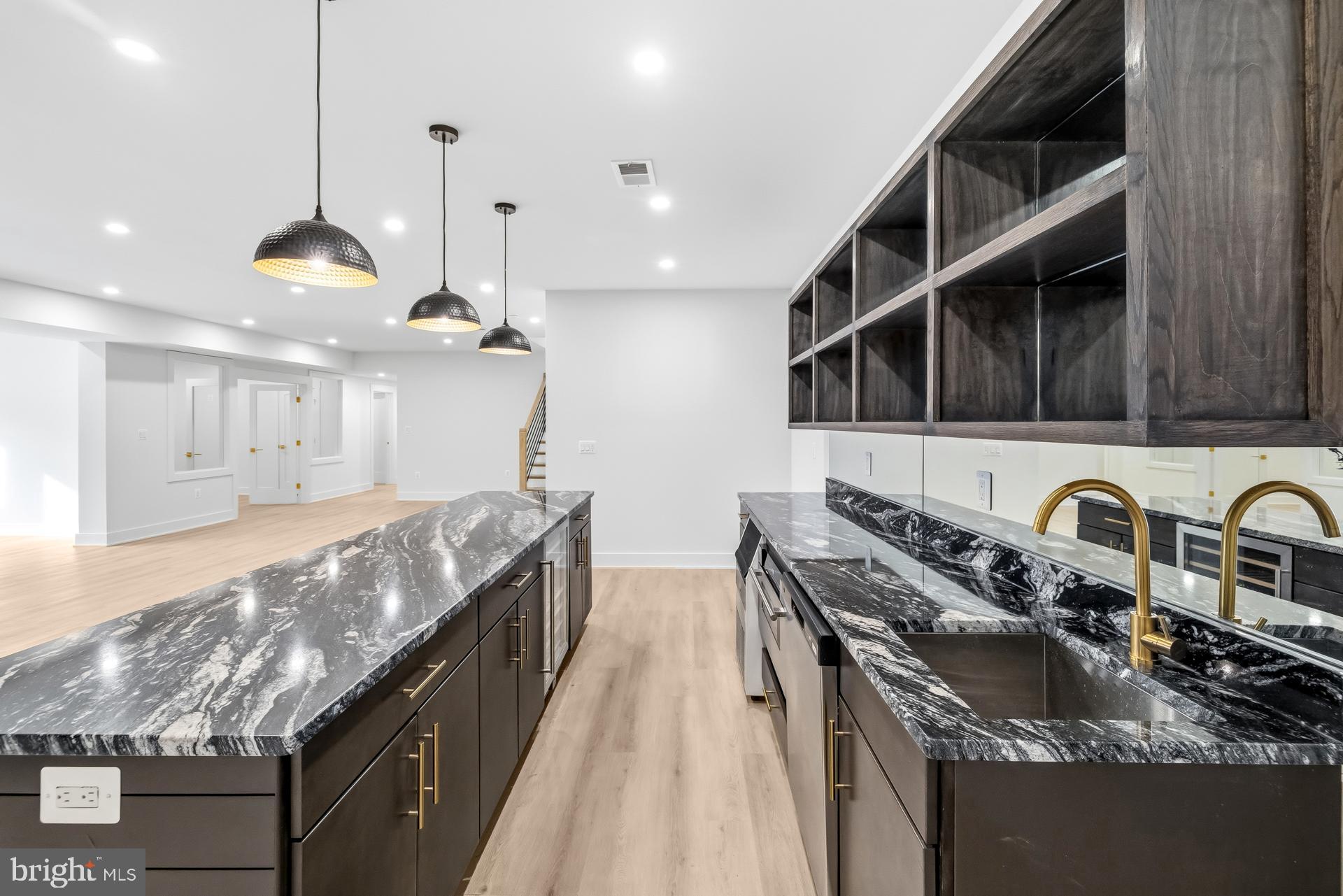719 Meadow Lane Southwest Vienna, VA 22180 - Photo 91 of 118 a kitchen with granite countertop a stove a sink and a refrigerator
