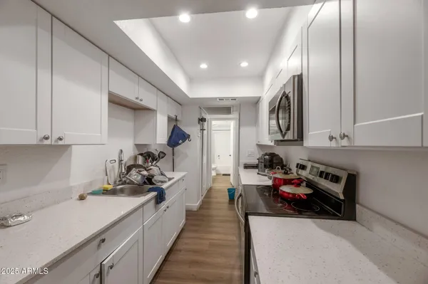 a kitchen that has a lot of cabinets