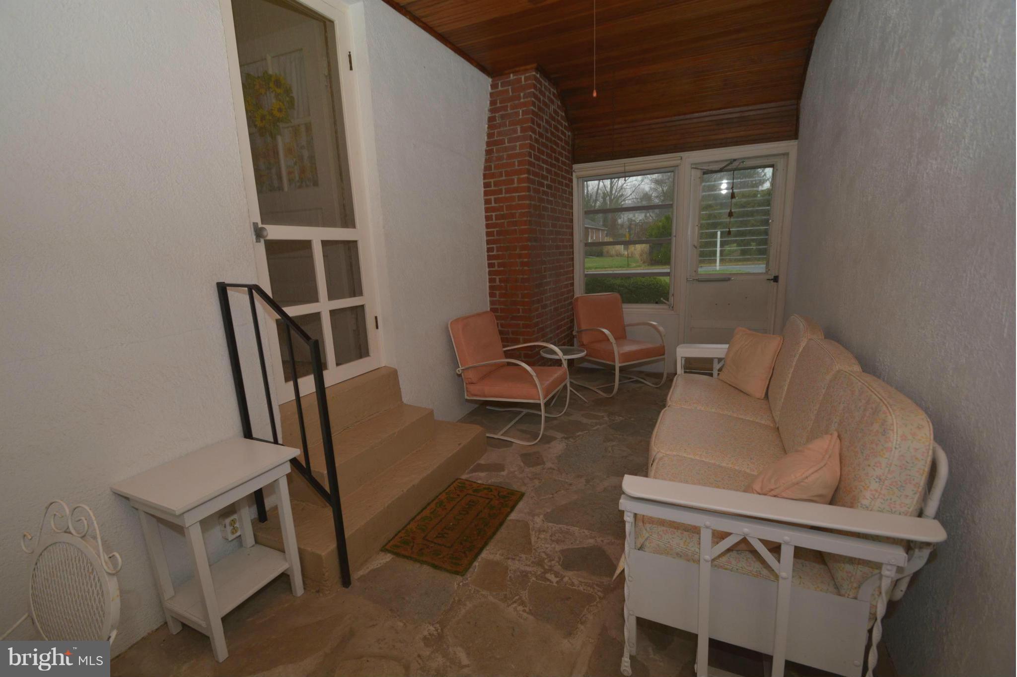 251 Gralan Road Baltimore, MD 21228 - Photo 19 of 24 Breezeway with stone floor, access to garage