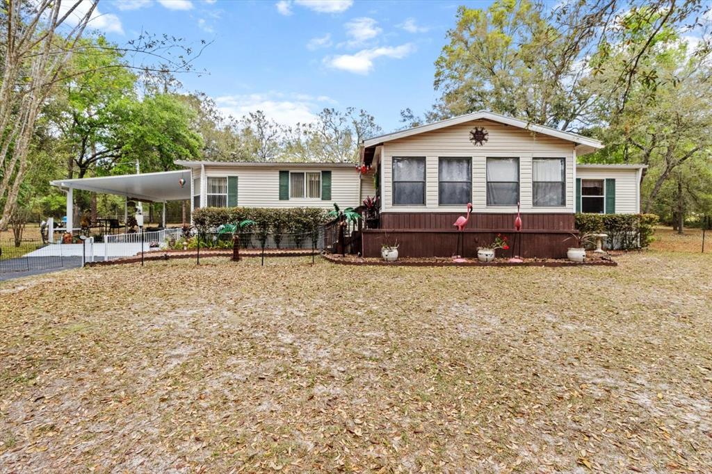 2999 East Dove Court Inverness, FL 34452 - Photo 1 of 1 a front view of a house with a yard
