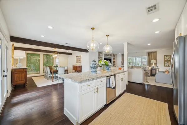 a large kitchen with granite countertop lots of counter top space
