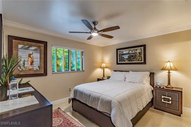 a bedroom with a bed and a desk