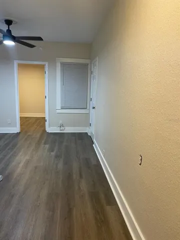 a view of wooden floor in an empty room