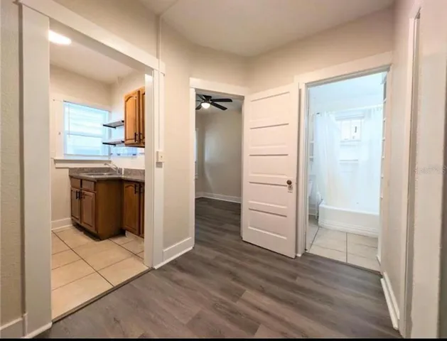 a kitchen with a refrigerator and a stove