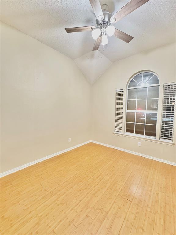 4005 Ridge Rock Drive Plano, TX 75074 - Photo 11 of 13 en view of an empty room with a window