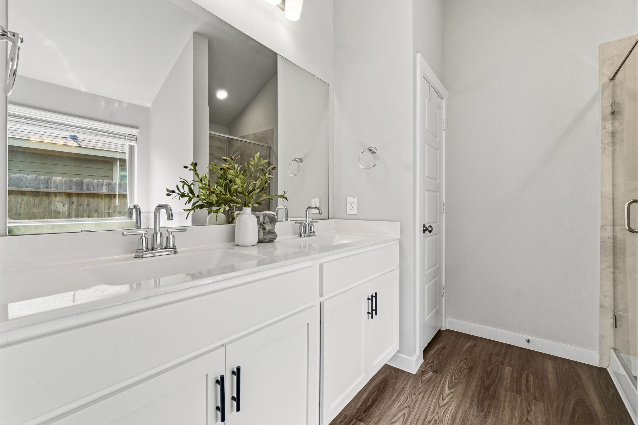 22235 Cardinal Crest Lane New Caney, TX 77357 - Photo 16 of 41 Spacious primary bathroom featuring a relaxing soaking tub, a separate glass-enclosed shower, dual vanities,