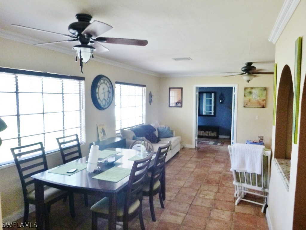 1767 Coronado Road Fort Myers, FL 33901 - Photo 8 of 17 a view of a dining room with furniture and a large window